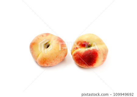Two saturn peaches or flat peaches isolated on white background with clipping path.. Two saturn peaches or flat peaches isolated on white background with clipping path.. 109949692