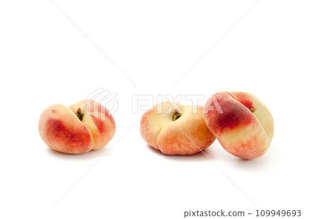 Three saturn peaches or flat peaches isolated on white background with clipping path.. 109949693