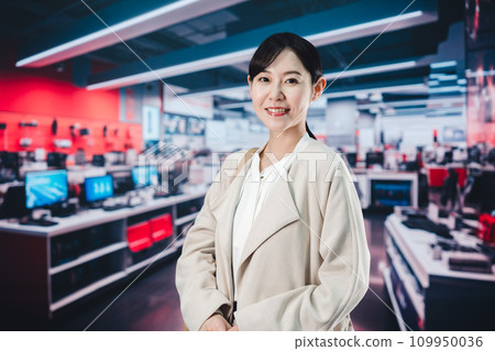 A woman shopping at a home appliance store A woman shopping at a home appliance store 109950036