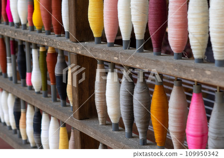 Stack of colorful silk rolls 109950342