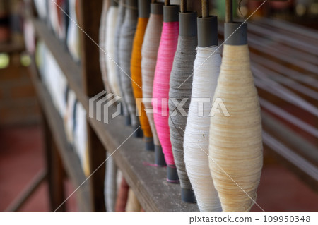 Stack of colorful silk rolls 109950348