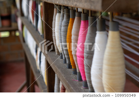 Stack of colorful silk rolls 109950349