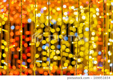 Warm golden Christmas lights creating magical background with soft bokeh effect. Christmas lights texture 109951654
