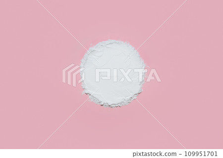 Clear white face powder with an empty circle on a soft pastel pink background, designed as a product placement backdrop for feminine beauty items. Clear white face powder with an empty circle on a soft pastel pink background, designed as a product placement backdrop for feminine beauty items. 109951701