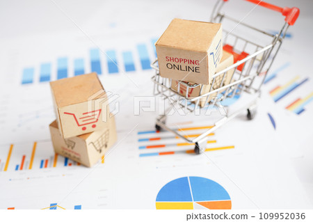 Online shopping, Shopping cart box on business graph, import export, finance commerce. Online shopping, Shopping cart box on business graph, import export, finance commerce. 109952036