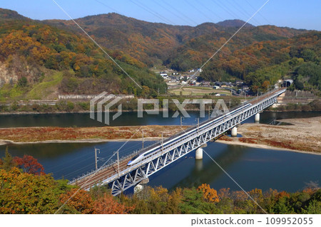 Sanyo Shinkansen 500 series train in autumn leaves Sanyo Shinkansen 500 series train in autumn leaves 109952055