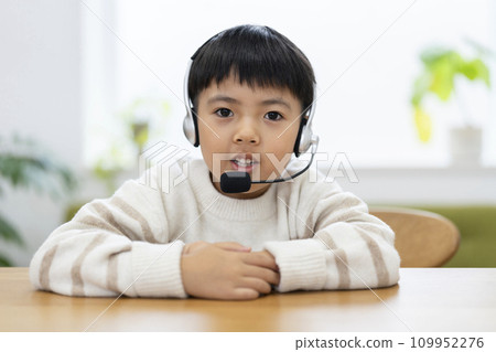 1st grade boy wearing an intercom 109952276