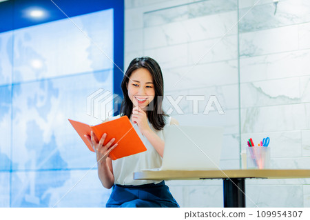 Business person working in a coworking space Business person working in a coworking space 109954307