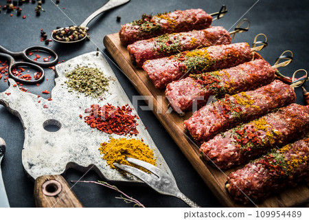 Raw kebab with spices Raw kebab with spices 109954489