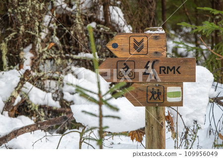 Hand-made wooden sign with directions RMK Estonian-Latvian border tourist trails Hand-made wooden sign with directions RMK Estonian-Latvian border tourist trails 109956049