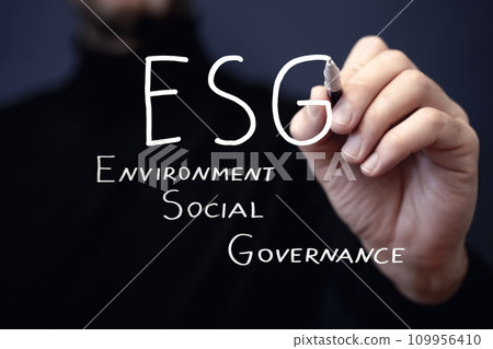 ESG strategy concept. Environmental, sustainable, governance. Businessman writes ESG 109956410