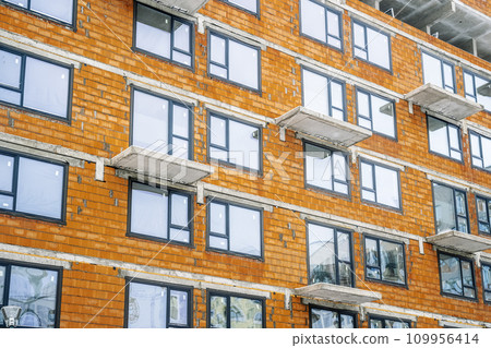 New apartment building of modern architecture. Modern residential quarter of the city. Development, construction, housing concept. 109956414