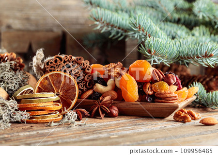 Christmas still-life with dried fruits and nuts. 109956485