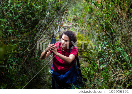 Young woman exploring the nature of a beautiful paramo at the department of Cundinamarca in Colombia Young woman exploring the nature of a beautiful paramo at the department of Cundinamarca in Colombia 109956591