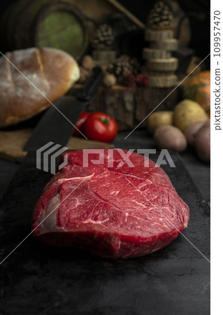 Raw beef steak in the rustic kitchen 109957470