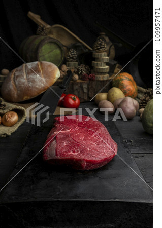 Raw beef steak in the rustic kitchen 109957471