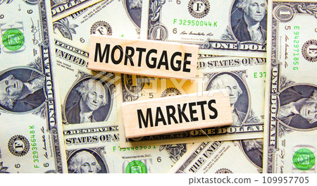 Mortgage markets symbol. Concept words Mortgage markets on beautiful wooden blocks. Dollar bills. Beautiful background from dollar bills. Business mortgage markets concept. Copy space. 109957705