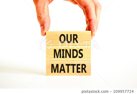 Our minds matter ourmindsmatter symbol. Concept words Our minds matter on wooden block. Beautiful white table white background. Businessman hand. Our minds matter ourmindsmatter concept. Copy space. Our minds matter ourmindsmatter symbol. Concept words Our minds matter on wooden block. Beautiful white table white background. Businessman hand. Our minds matter ourmindsmatter concept. Copy space. 109957724