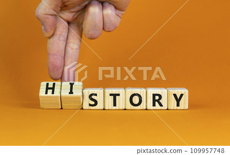 Story and history symbol. Historic turns a cube, changes the word story to history. Beautiful orange table, orange background. Business, historical and story or history concept. Copy space. Story and history symbol. Historic turns a cube, changes the word story to history. Beautiful orange table, orange background. Business, historical and story or history concept. Copy space. 109957748