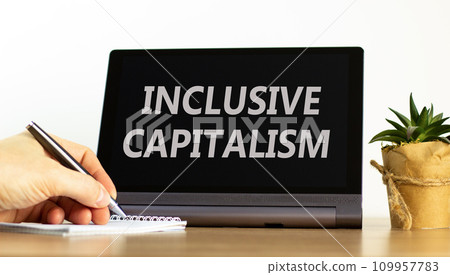 Inclusive capitalism symbol. Concept words Inclusive capitalism on beautiful black tablet. Beautiful white background. Businessman hand. Business inclusive capitalism concept. Copy space. 109957783
