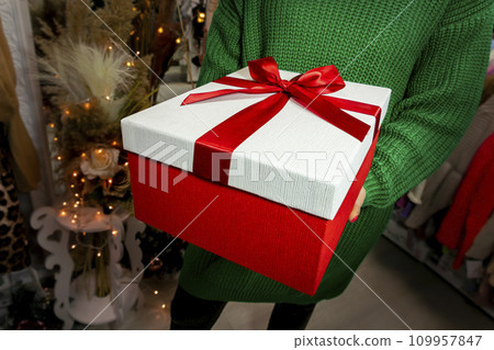 Gift, present in womans hands. Christmas, New Year, Birthday, Valentines day concept 109957847