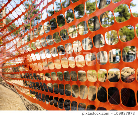 Construction safety orange net at the construction site outdoors 109957978