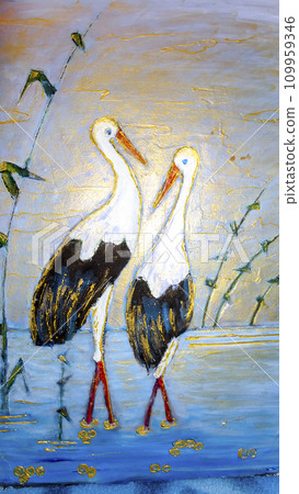 Two storks stand in a pond. A married couple of storks. Two storks stand in a pond. A married couple of storks. 109959346
