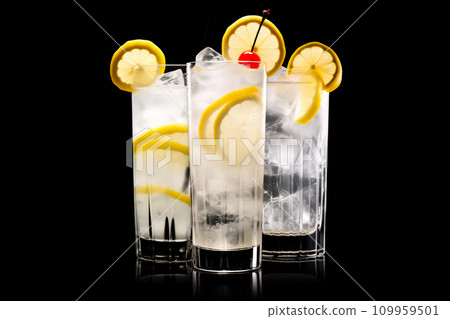 Set of classic Tom Collins or Whiskey sour cocktail with a maraschino cherry and lemon slice on black background Set of classic Tom Collins or Whiskey sour cocktail with a maraschino cherry and lemon slice on black background 109959501