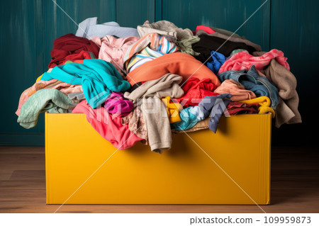 Clothes donation. Box of use old cloth. Preparing garment at home before donate. Generative AI 109959873