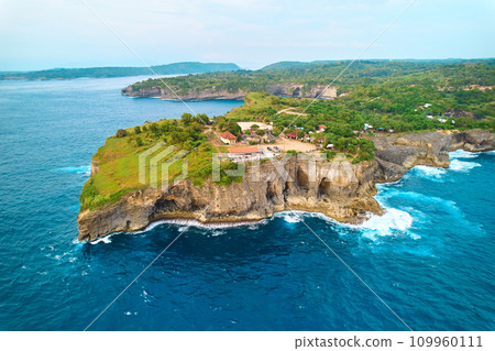 Cinematic aerial landscape shots of the beautiful island of Nusa Penida. Huge cliffs by the shoreline and hidden dream beaches with clear water. Cinematic aerial landscape shots of the beautiful island of Nusa Penida. Huge cliffs by the shoreline and hidden dream beaches with clear water. 109960111
