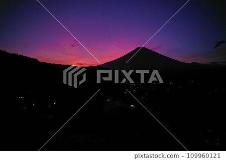 Silhouette of the Agung volcano at sunset. Panorama of the mountain on the island of Bali. 109960121