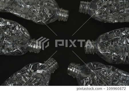 Crushed empty plastic bottle on black background 109960872