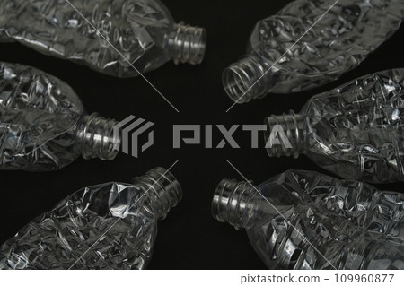 Crushed empty plastic bottle on black background 109960877