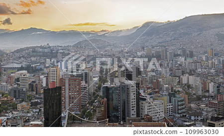 Panoramic view of the south-east part of Quito downtown at sunset 109963030