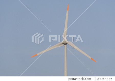 Wind power generator shining in the blue sky Wind power generator shining in the blue sky 109968876