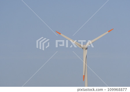 Wind power generator shining in the blue sky Wind power generator shining in the blue sky 109968877