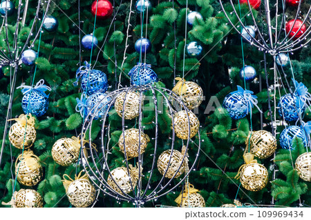 Beautiful Christmas decorations hanging on Christmas tree 109969434