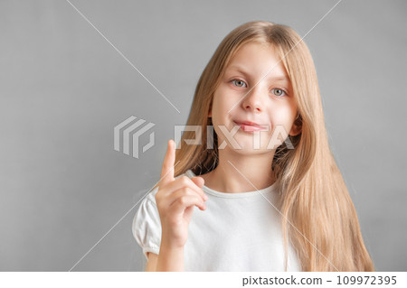 Adorable little girl direct finger up 109972395