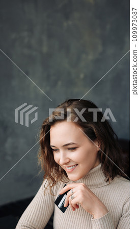 Convenient Online Shopping. Young Woman with Credit Card and Laptop Engages in E-commerce. Young 109973087