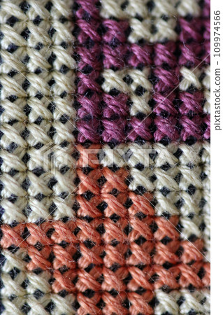 Mixed colour cross stitch embroidery in macro close up Mixed colour cross stitch embroidery in macro close up 109974566