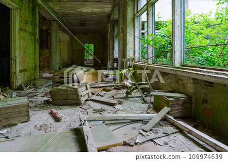 Corridor of abandoned school in resettled village of Pogonnoye in exclusion zone of Chernobyl nuclear power plant, Belarus 109974639