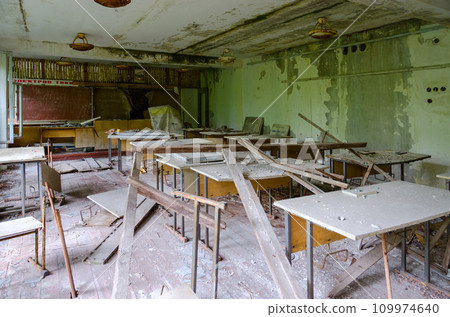 Devastation in premises of abandoned school in resettled village of Pogonnoye in exclusion zone of Chernobyl nuclear power plant, Belarus 109974640