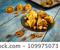 Cracked snails with sourdough on a blue table 109975073