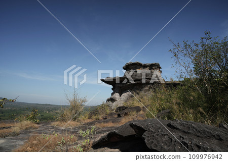 Stone texture with dark blue sky 109976942
