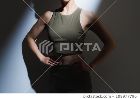 A woman wearing training wear 109977796