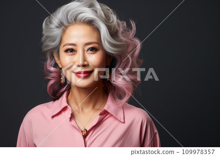 Smiling middle aged asian woman looking at camera 109978357