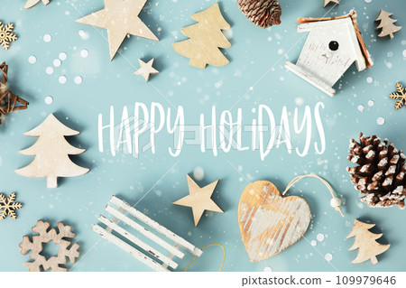 Wooden Christmas decorations on blue background, retro style, eco friendly trendy zero waste Wooden Christmas decorations on blue background, retro style, eco friendly trendy zero waste 109979646