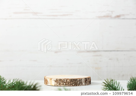 Wooden podium and christmas decorations on grey background. 109979654