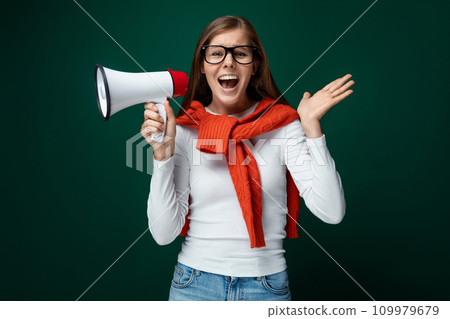 Smart young woman holding microphone for news and advertising Smart young woman holding microphone for news and advertising 109979679