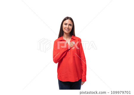 charming young business woman with black hair dressed in a loose red shirt on a white background 109979701